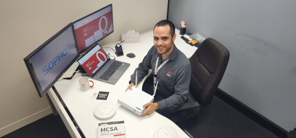 Qbit technician Devante configuring a firewall as part of SMB1001 Bronze tier controls